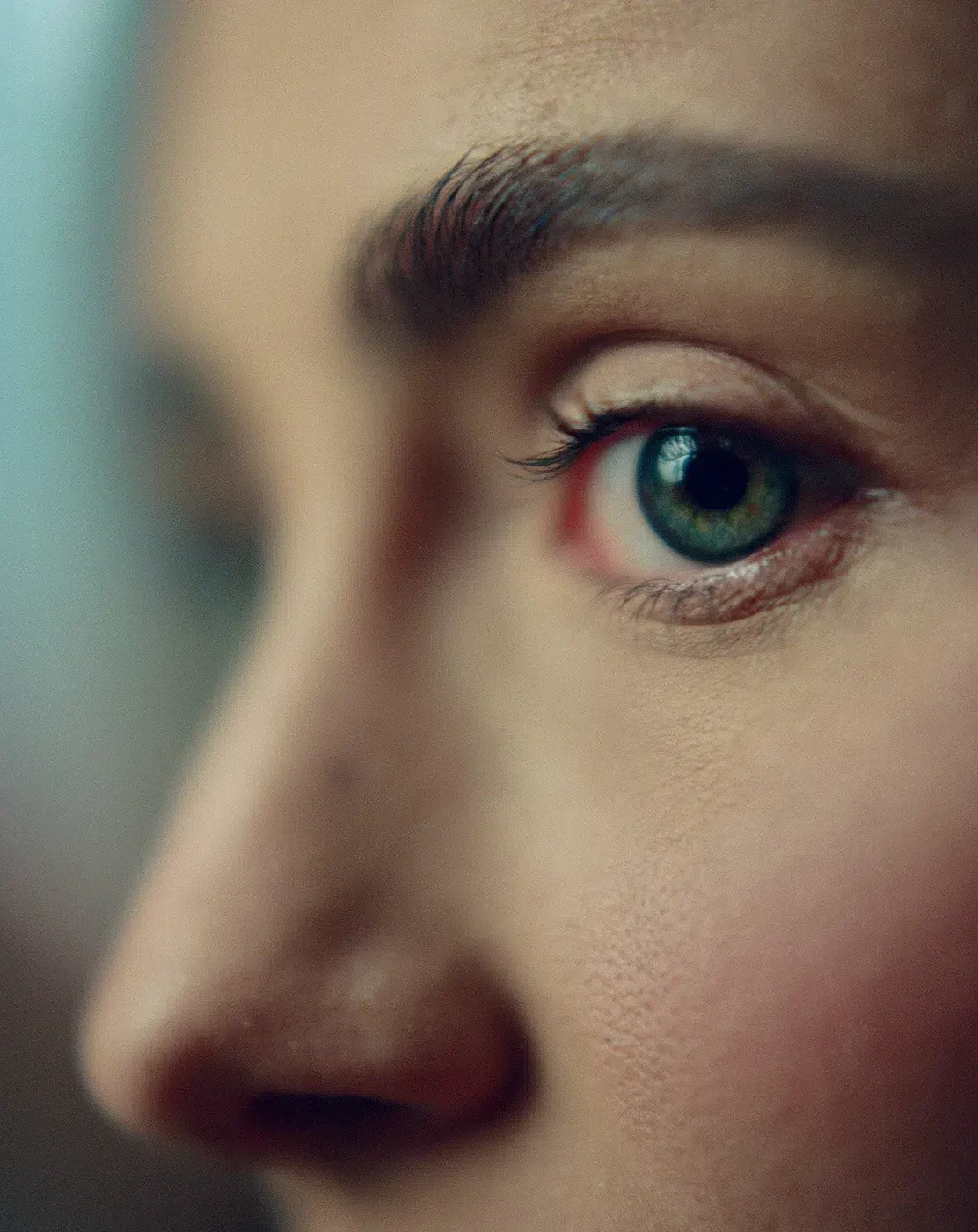 Close-up of a person's face, with one eye in focus.